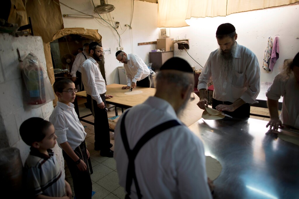 (Oded Balilty | The Associated Press) Ultra-Orthodox Jews prepare special matzoh, a traditional handmade Passover unleavened bread, at a bakery in Bnei Brak, Israel. Wednesday, April 20, 2016. Jews are forbidden to eat leavened foodstuffs during the Passover holiday that celebrates the biblical story of the Israelites' escape from slavery and exodus from Egypt.