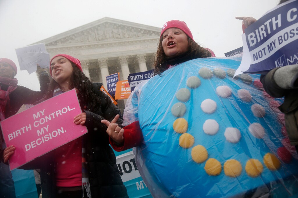 FILE - In this March 25, 2015 file photo, Margot Riphagen of New Orleans, La., wears a birth control pills costume during a protest in front of the U.S. Supreme Court in Washington. (AP Photo/Charles Dharapak, File)