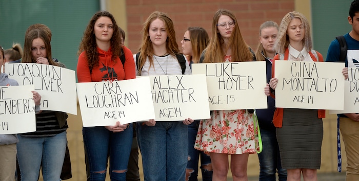 (Al Hartmann  |  The Salt Lake Tribune) 	
About 80 students at Westlake High School in Saratoga Springs left class and stood together in silence at the front entrance of the school Wednesday March 14, 2018 to remember the 17 students who died in a school shooting in Florida.  They held posters of the names of those killed. 