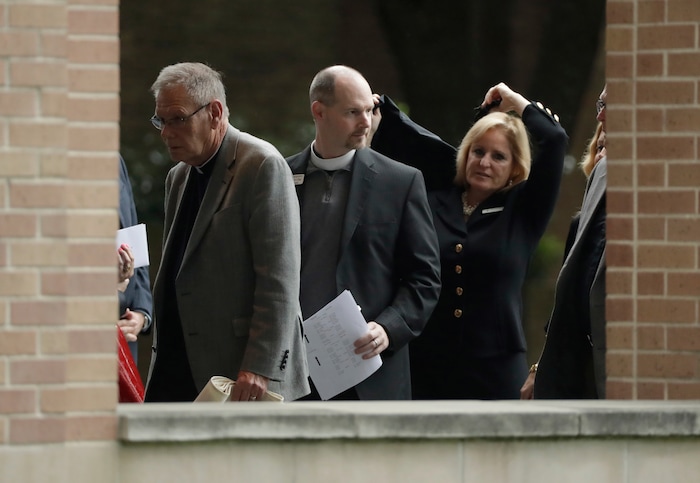 Attendees arrive at St. Martin's Episcopal Church for a funeral service for former first lady Barbara Bush, Saturday, April 21, 2018, in Houston. (AP Photo/Evan Vucci)