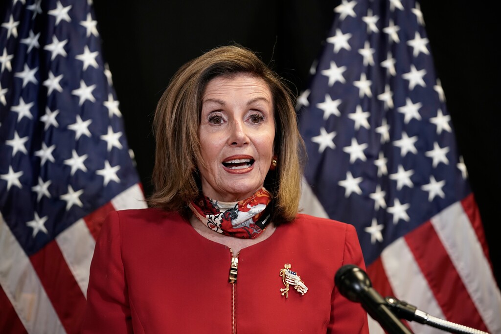 (J. Scott Applewhite | AP photo)
Speaker of the House Nancy Pelosi, D-Calif., talks to reporters about Election Day results in races for the House of Representatives, at Democratic National Committee headquarters in Washington, Tuesday, Nov. 3, 2020. She was joined on a video call by Rep. Cheri Bustos, D-Ill., chairwoman of the Democratic Congressional Campaign Committee.