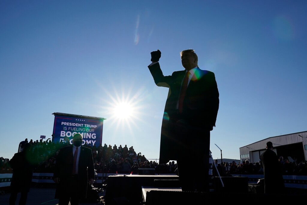 President Donald Trump gestures to supporters after speaking at a campaign rally at Green Bay Austin Straubel International Airport, Friday, Oct. 30, 2020, in Green Bay, Wis. (AP Photo/Alex Brandon)