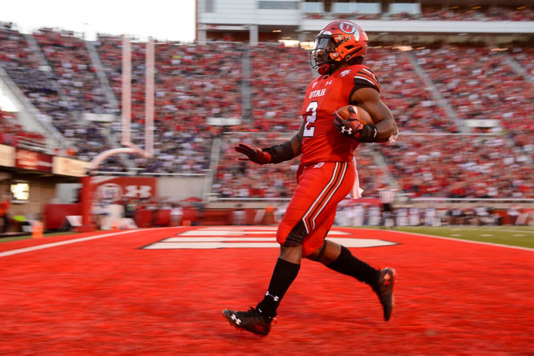 (Trent Nelson | The Salt Lake Tribune)  Utah Utes running back Zack Moss (2) scores a touchdown as the University of Utah Utes host the Weber State Wildcats, Thursday Aug. 30, 2018 at Rice-Eccles Stadium in Salt Lake City.