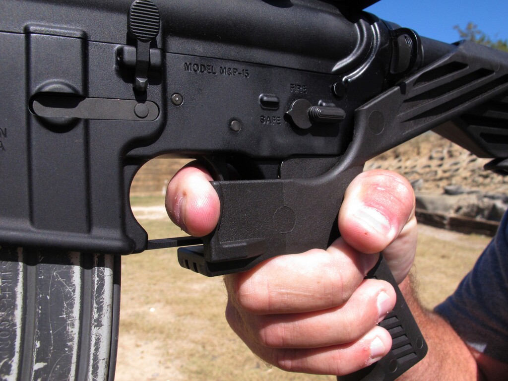 (Allen G. Breed | The Associated Press) In this Oct. 4, 2017, file photo, shooting instructor Frankie McRae demonstrates the grip on an AR-15 rifle fitted with a "bump stock" at his 37 PSR Gun Club in Bunnlevel, N.C. The Brady Center to Prevent Gun Violence filed the lawsuit on Friday, Oct. 6, 2017, against the makers and sellers of "bump stocks," which use the recoil of a semiautomatic rifle to let the finger "bump" the trigger, allowing the weapon to fire continuously. The devices were used by Stephen Paddock when he opened fire on a country music festival in Las Vegas, killing dozens of people. Attorneys for a California woman wounded in the Oct. 1 mass shooting that killed 58 and left hundreds injured on the Las Vegas Strip have dropped a gun accessories maker from her negligence and damages lawsuit.