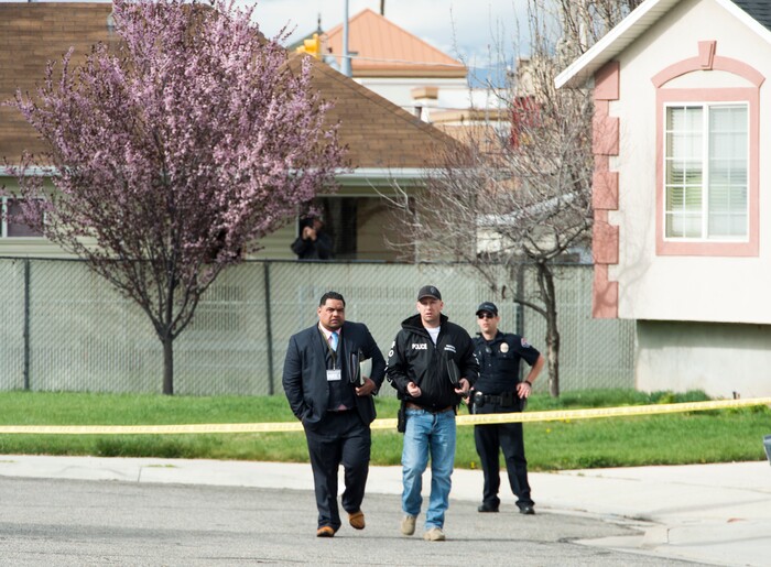 (Rick Egan | The Salt Lake Tribune) Investigators from West Valley and Unified Police investigate an officer involved shooting, leaving the suspect dead, in West Valley City, Sunday, April 8, 2018.
