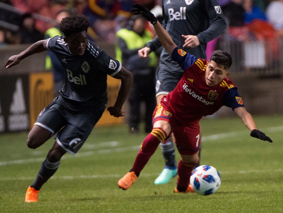 (Rick Egan  |  The Salt Lake Tribune)      Real Salt Lake forward Jefferson Savarino (7) goes for the ball along with Vancouver Whitecaps forward Alphonso Davies (67), in MLS action between Real Salt Lake and Vancouver Whitecaps, at Rio Tinto Stadium beSaturday, April 7, 2018.