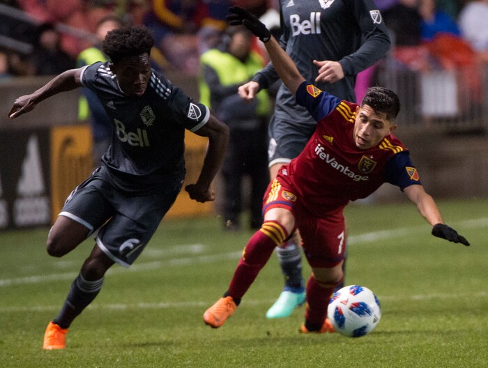 (Rick Egan  |  The Salt Lake Tribune)      Real Salt Lake forward Jefferson Savarino (7) goes for the ball along with Vancouver Whitecaps forward Alphonso Davies (67), in MLS action between Real Salt Lake and Vancouver Whitecaps, at Rio Tinto Stadium beSaturday, April 7, 2018.


