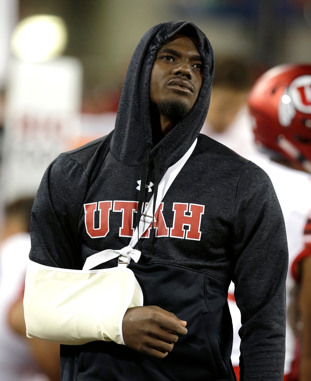 Utah quarterback Tyler Huntley watches from the side line after getting injured in the first half during an NCAA college football game against Arizona, Friday, Sept. 22, 2017, in Tucson, Ariz. Utah defeated Arizona 30-24. (AP Photo/Rick Scuteri)