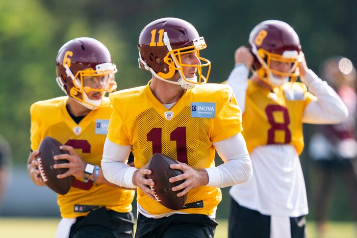 Washington quarterbacks Steven Montez (6), Alex Smith (11) and Kyle Allen (8) work during practice at the team's NFL football training facility, Tuesday, Aug. 25, 2020, in Ashburn, Va. (AP Photo/Alex Brandon)