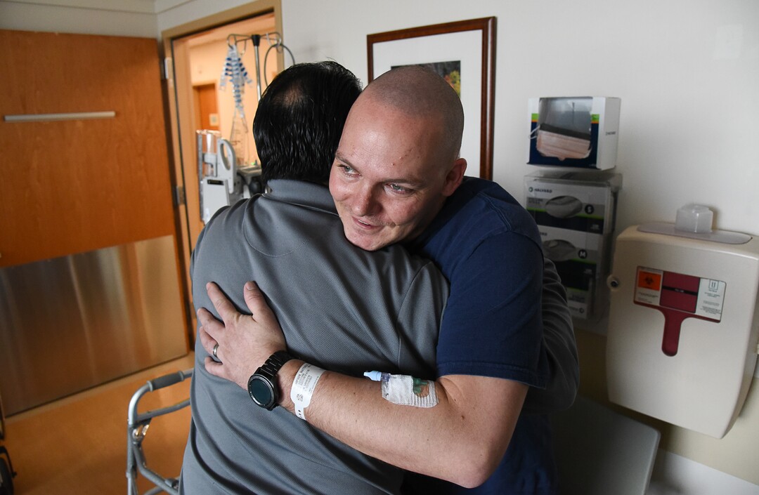 (Francisco Kjolseth  |  The Salt Lake Tribune)  Matthew Thompson is embraced by Willie Salas as he expresses his gratitude for the generous kidney donation Thompson made to his son Mitchell earlier in the week at Intermountain Medical in Murray. "Thank you for giving life back to my boy," exclaimed Salas. 