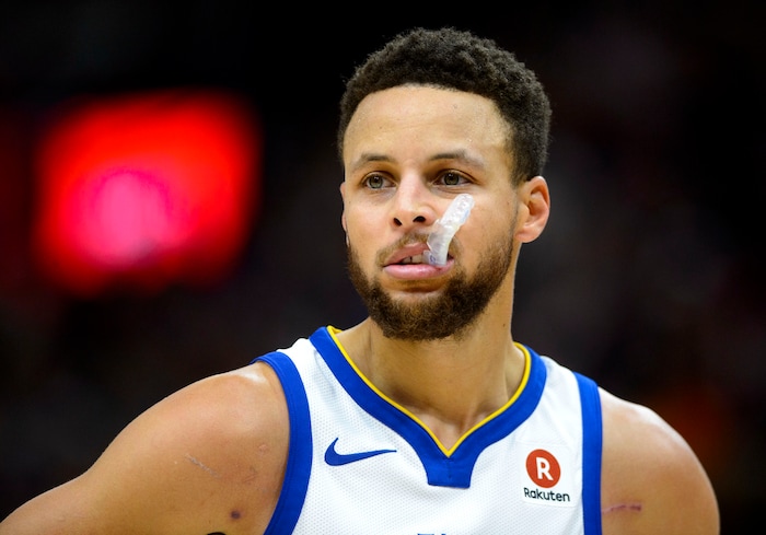 (Steve Griffin  |  The Salt Lake Tribune) Golden State Warriors guard Stephen Curry (30) chews on his mouth guard as the Jazz build a big lead during the Utah Jazz versus Golden State Warriors at Vivint Smart Home Arena in Salt Lake City Tuesday January 30, 2018.