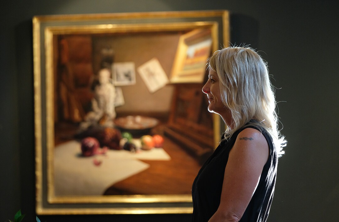 (Francisco Kjolseth  |  The Salt Lake Tribune)  Jana Larson welcomes people to the art gallery of Steve Adams who bought the JC Penney store on Main Street Helper and created an art studio on the main floor and a home on the Mezzanine.