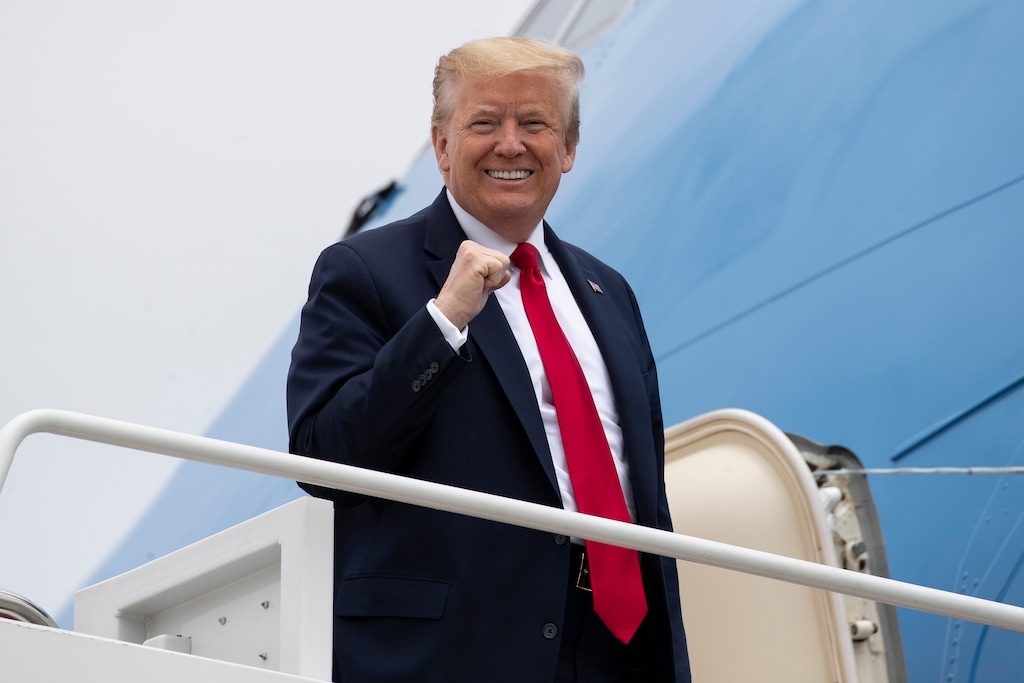 (Alex Brandon | AP) President Donald Trump pumps his fist while boarding Air Force One as he departs Thursday, May 21, 2020, at Andrews Air Force Base, Md. Trump will visit a Ypsilanti, Mich., Ford plant that has been converted to making personal protection and medical equipment.