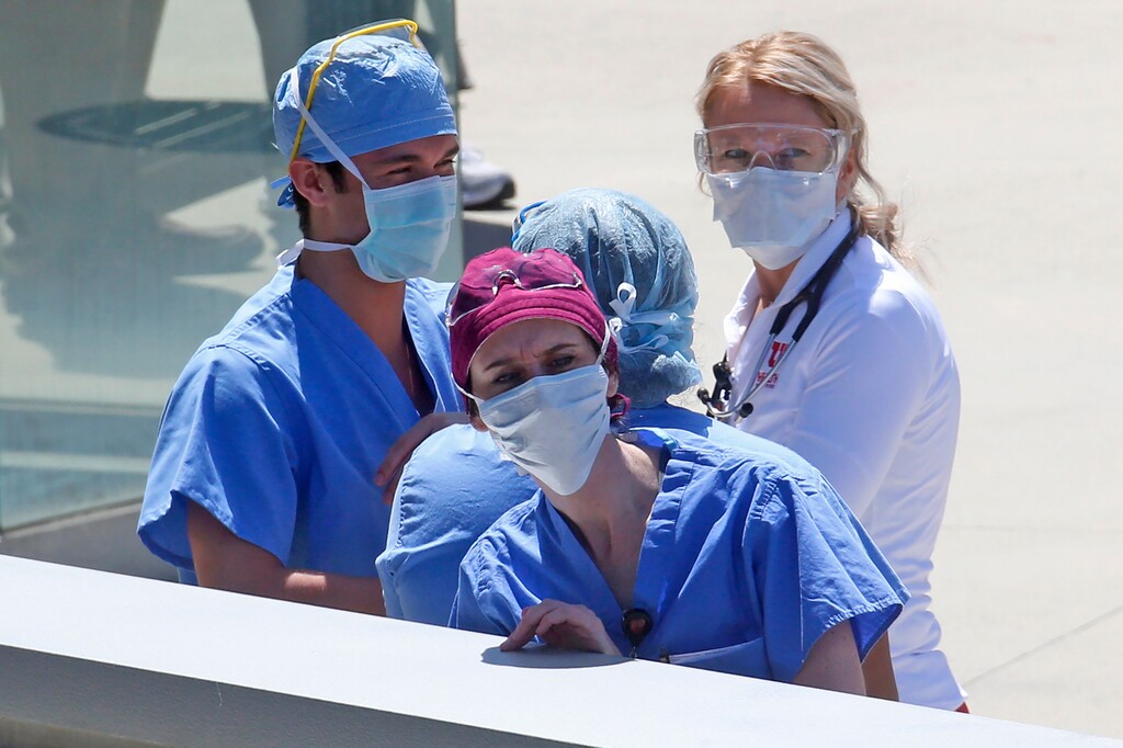 (AP file photo/Rick Bowmer) Health care workers at the University of Utah Hospital on Thursday, April 30, 2020.