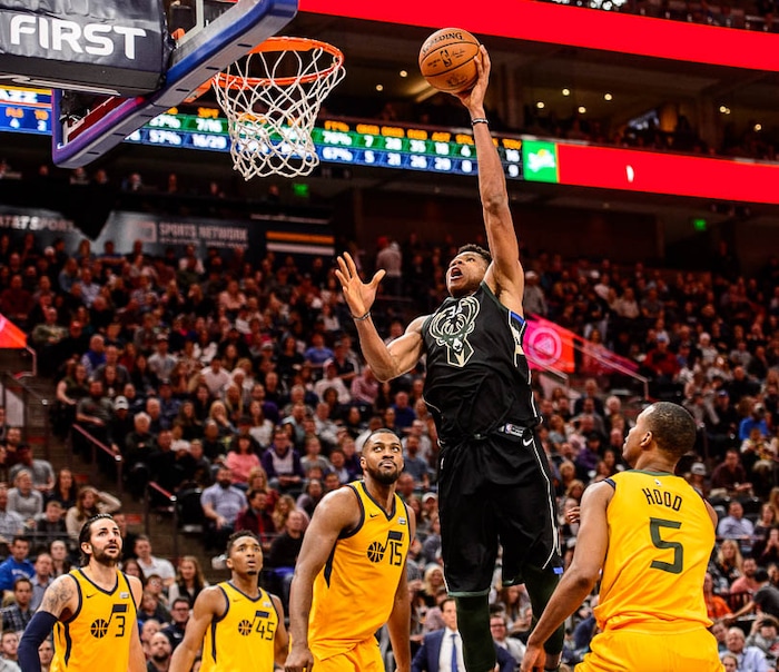 (Trent Nelson | The Salt Lake Tribune)  Milwaukee Bucks forward Giannis Antetokounmpo (34) dunks the ball as the Utah Jazz host the Milwaukee Bucks, NBA basketball in Salt Lake City Saturday November 25, 2017.
