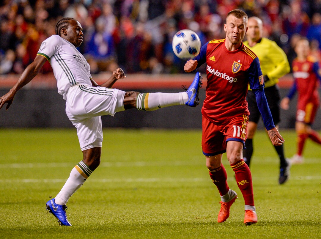 Leah Hogsten  |  The Salt Lake Tribune  Real Salt Lake midfielder Albert Rusnak (11) and Portland Timbers midfielder Diego Chara (21) fight for the ball as Real Salt Lake hosts the Portland Timbers at Rio Tinto Stadium in Sandy, Saturday, Oct. 6, 2018.