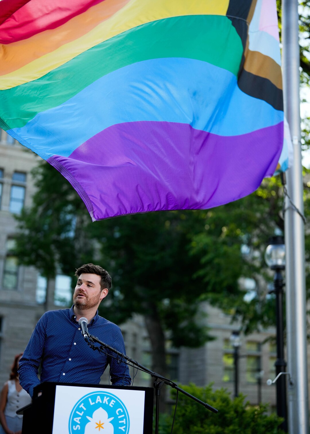 (Francisco Kjolseth  | The Salt Lake Tribune) Salt Lake City council member Chris Wharton joins in the annual raising of the pride flag at City Hall to kickstart a month of festivities for Utah Pride on Friday, May 30, 2025. It is especially notable this year given the state tried to stop the pride flag from flying over government grounds.