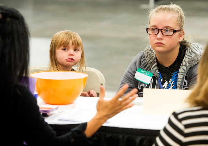 (Rick Egan  |  The Salt Lake Tribune)  Hailey Bartlett and her 3-year-old daughter, Abigail Fletcher, talk to legal help advisers during Project Homeless Connect on Friday, October 6, 2017. The one-day event in Salt Lake City brings together community volunteers to provide services for individuals and families experiencing homelessness.