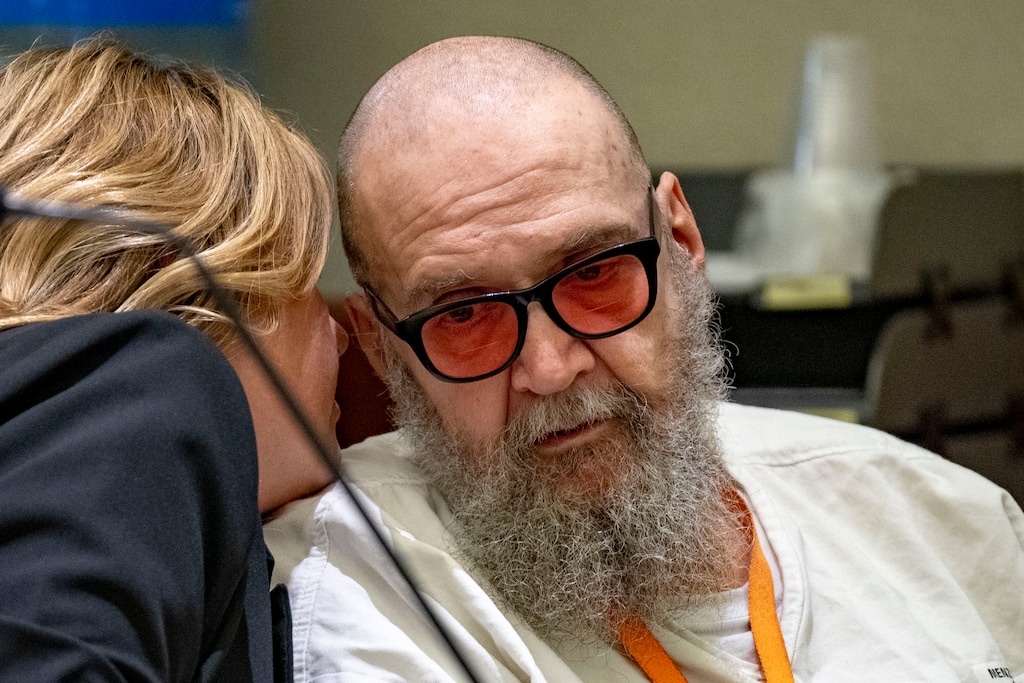 (Rick Egan | The Salt Lake Tribune) Jasmine North, federal public defender mitigation investigator, speaks with Ralph Leroy Menzies during his competency hearing in 3rd District Court in West Jordan, on Monday, Nov 18, 2024.