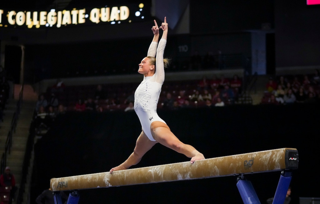 (Bethany Baker  |  The Salt Lake Tribune) Utah’s Avery Neff competes on the beam during the Collegiate Quad gymnastics event at The Maverik Center in West Valley City on Saturday, Jan. 10, 2026.