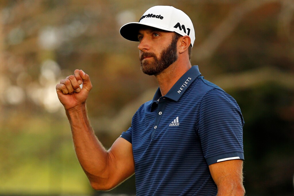 Dustin Johnson reacts after winning The Northern Trust golf tournament on a playoff hole over Jordan Spieth on Sunday, Aug. 27, 2017, in Old Westbury, N.Y. (AP Photo/Adam Hunger)