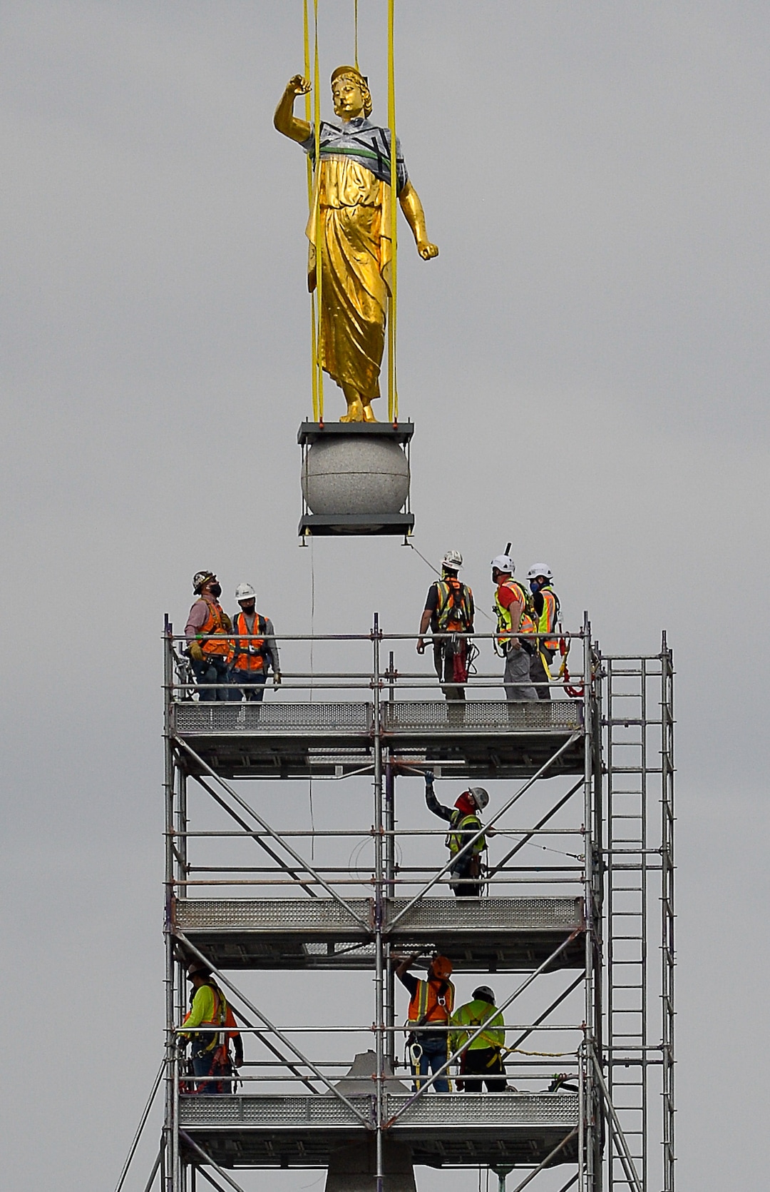 (Francisco Kjolseth  |  The Salt Lake Tribune) Crews work to remove the Angel Moroni statue atop The Salt Lake Temple of The Church of Jesus Christ of Latter-day Saints on Monday, May 18, 2020. The temple closed in December for seismic upgrades and sustained minor damager during the March 18, 2020, magnitude 5.7 earthquake when the trumpet held by the angel fell off and several smaller spire stones were displaced.