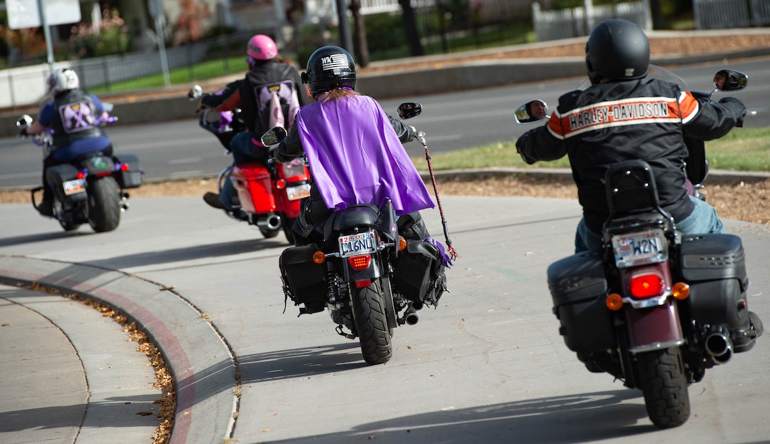 (Francisco Kjolseth  |  The Salt Lake Tribune) Bikers Against Domestic Violence show their support for the YWCA Utah as they stop at Liberty Park in Salt Lake City, on Saturday, Oct. 17, 2020, to recognize the thousands of individuals in Utah who are impacted by domestic violence each year for the Stop the Violence Utah campaign.