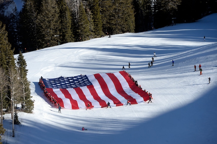 (Al Hartmann  |  The Salt Lake Tribune) 	Sundance Mountain Resort partnered with Follow the Flag to ski a giant American Flag down Bearclaw run. The flag is 78' x 150' and weighs more than 400 pounds, the largest free-flying American flag in the world. It took coordination of 50 of Sundance's best skiers to pull it off.  This event is to express patriotism and support of Team USA and athletes representing the country in the upcoming Winter Olympics in Pyeongchang, South Korea. 