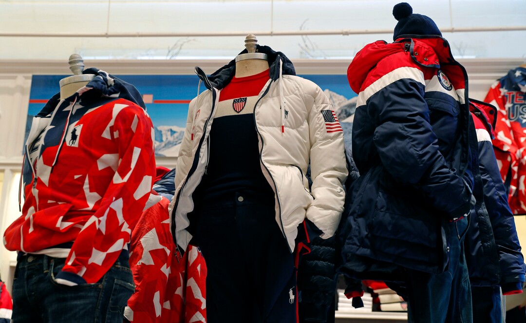 A white parka, center, designed by David Lauren for Polo Ralph Lauren is shown in the brand's Prince Street store, Monday, Jan. 22, 2018, in New York. The jacket is part of Team USA's closing ceremony uniform for the upcoming Winter Olympics in Pyeongchang, South Korea. (AP Photo/Kathy Willens)