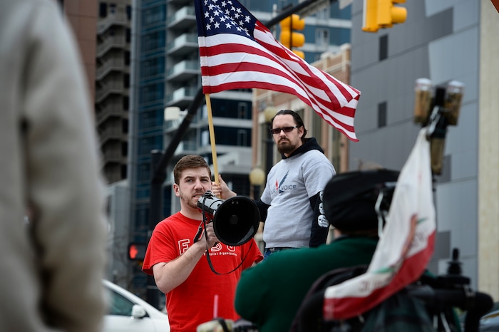 (Scott Sommerdorf | The Salt Lake Tribune)
Nick Godfrey spoke on the bullhorn as a group of about 40 people protested the strikes on Syria, Sunday, April 15, 2018.