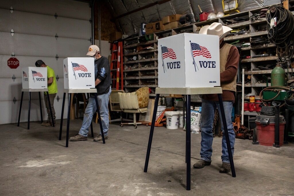 (Kathryn Gamble/The New York Times) People voting on the last day of early voting at the Story County Administration in Nevada, Iowa, Monday, Nov. 3, 2020.