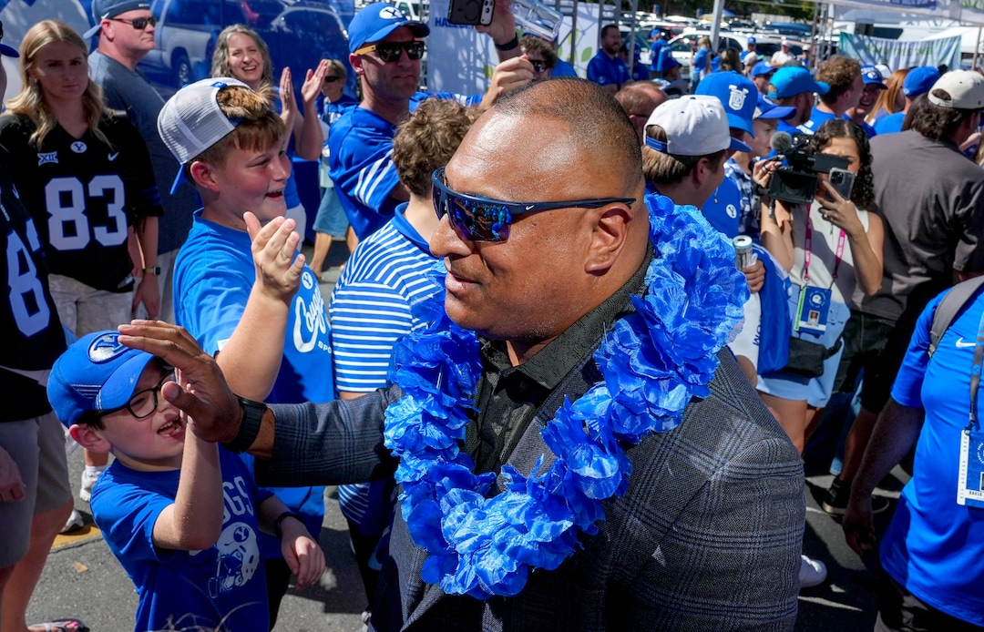 (Francisco Kjolseth | The Salt Lake Tribune) BYU head coach Kalani Sitake greets fans as BYU arrives for their game against Utah Tech at LaVell Edwards Stadium in Provo on Saturday, Sept. 5, 2026. 