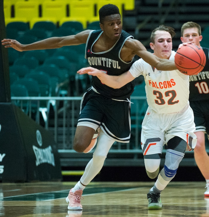 (Rick Egan  |  The Salt Lake Tribune)   Bountiful Braves Jaxon Wood (5) steals the ball from Skyridge Falcons Joe White (32), in 5A basketball playoff action between the Bountiful Braves and Skyridge Falcons, at the UCCU Center in Orem, Monday, Feb. 26, 2018.