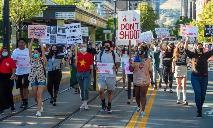 (Rick Egan  |  The Salt Lake Tribune) Protesters stop traffic as they march down Main Street in Salt Lake City during a demonstration for Bernardo Palacios-Carbajal on Monday, June 22, 2020.
