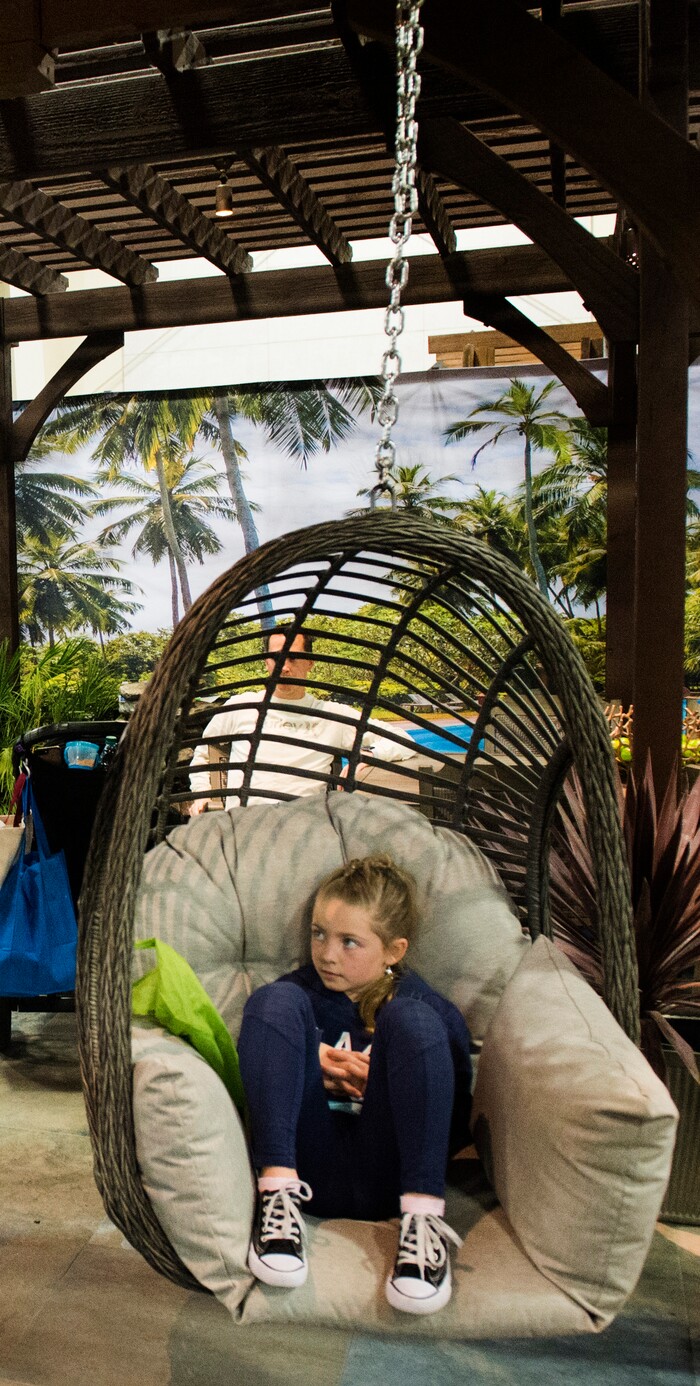 (Rick Egan  |  The Salt Lake Tribune)   Lila Hansen, 8, sits in a porch swing at the Salt Lake Tribune Home & Garden show, at the Mountain America Expo Center in Sandy, Saturday, March 10, 2018. 