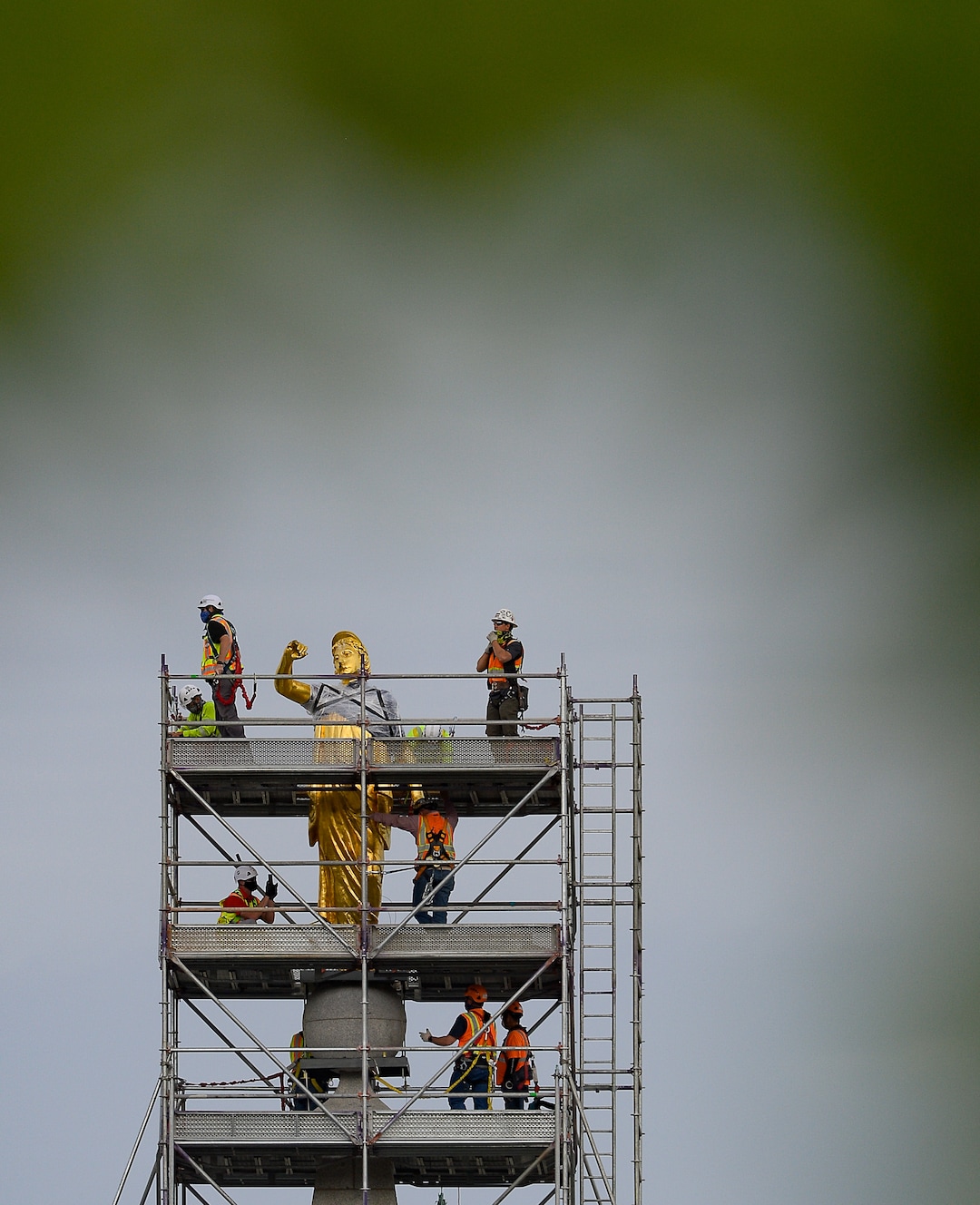 (Francisco Kjolseth  |  The Salt Lake Tribune) Crews work to remove the Angel Moroni statue atop the Salt Lake Temple of The Church of Jesus Christ of Latter-day Saints on Monday, May 18, 2020. The temple closed in December for seismic upgrades and sustained minor damager during the March 18, 2020, magnitude 5.7 earthquake when the trumpet held by the angel fell off and several smaller spire stones were displaced.