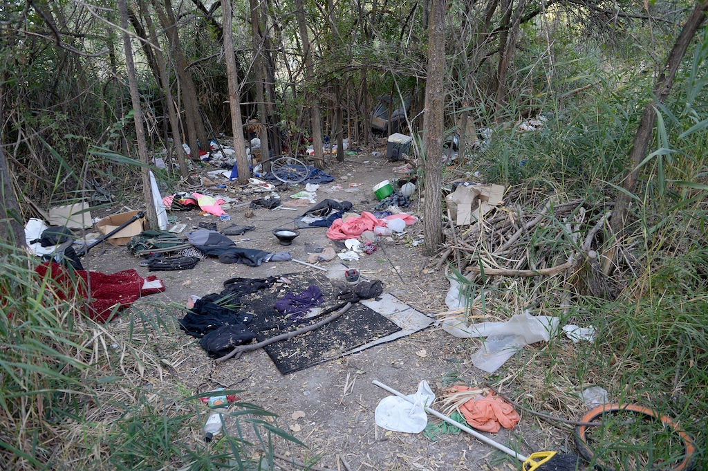 (Al Hartmann | Tribune file photo)
After Operation Rio Grande, homeless camps have popped up everywhere. Some of the homeless have set up camps in the thick vegetation near the Jordan River south of 3900 S. and 900 W. just 50 yards off the Jordan River Parkway Trail. Camps are full of garbage, tarps, coolers and sleeping bags. Disposal of human waste at the camps is a health problem.