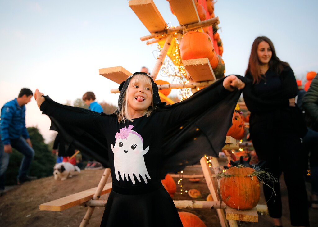 A little girl shows off her Halloween costume. (AP Photo/Vadim Ghirda)