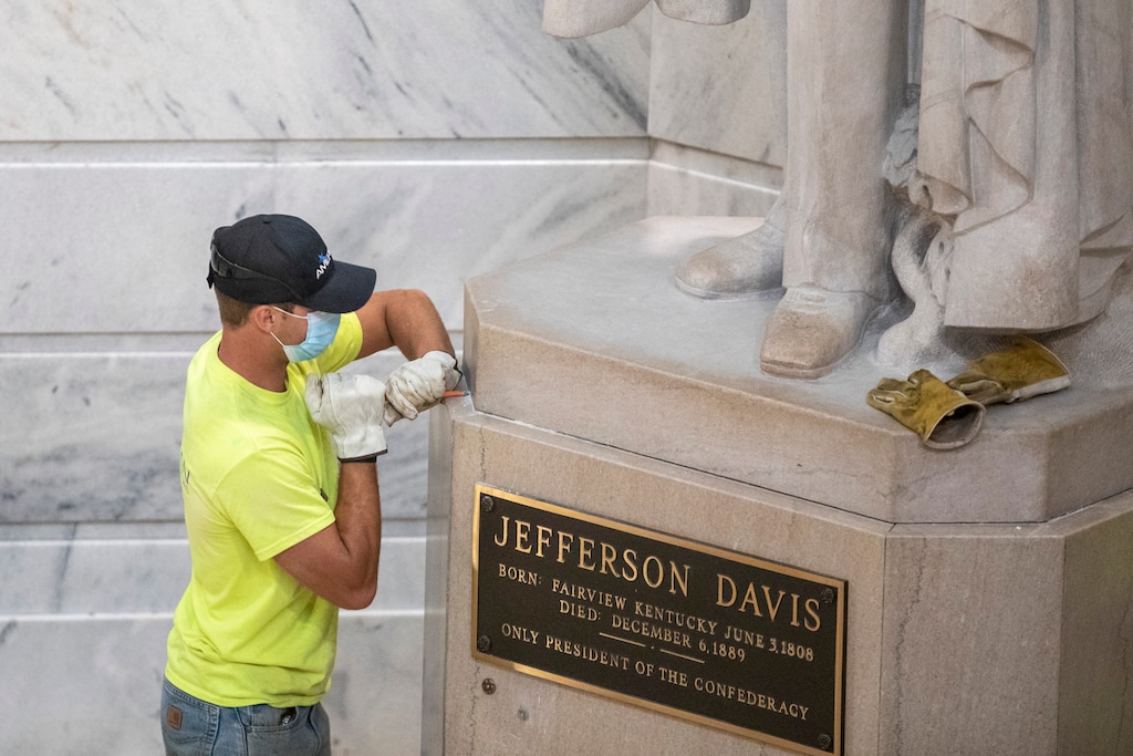A worker prepares to remove the Jefferson Davis statue from the Kentucky state Capitol in Frankfort, Ky., on Friday, June 12, 2020. (Ryan C. Hermens/Lexington Herald-Leader via AP)
