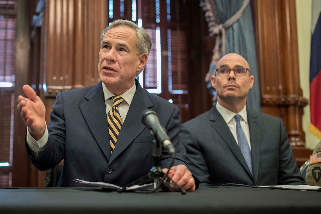 (Jay Janner | Austin American-Statesman via AP, file) In this June 21, 2019 file photo, Gov. Greg Abbott, left, speaks at a news conference at the Capitol, in Austin, Texas. Abbott says the state will reject the resettlement of new refugees, becoming the first state known to do so under a recent Trump administration order. In a letter released Friday, Jan. 10, 2020, Abbott wrote that Texas "has been left by Congress to deal with disproportionate migration issues resulting from a broken federal immigration system." He added that Texas, which typically takes in thousands of refugees each year, has done "more than its share." Governors in 42 other states have said they will consent to allow more refugees, according to the Lutheran Immigration and Refugee Service.