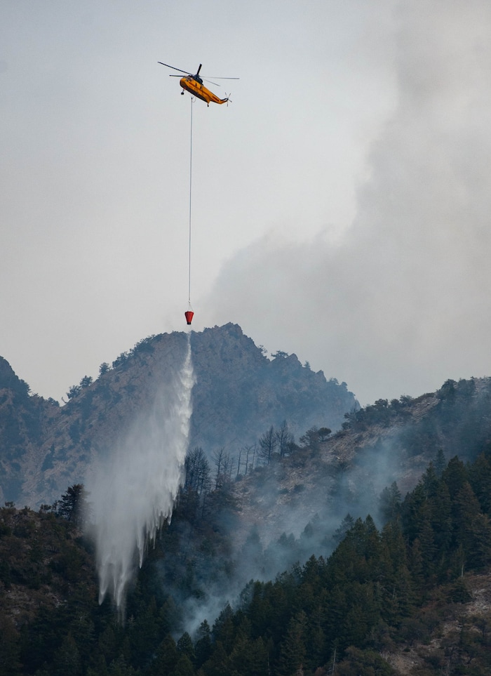 (Francisco Kjolseth  |  The Salt Lake Tribune) Air crews battle a fire in Neffs Canyon on the north side of Mount Olympus on Tuesday, Sept, 22, 2020.