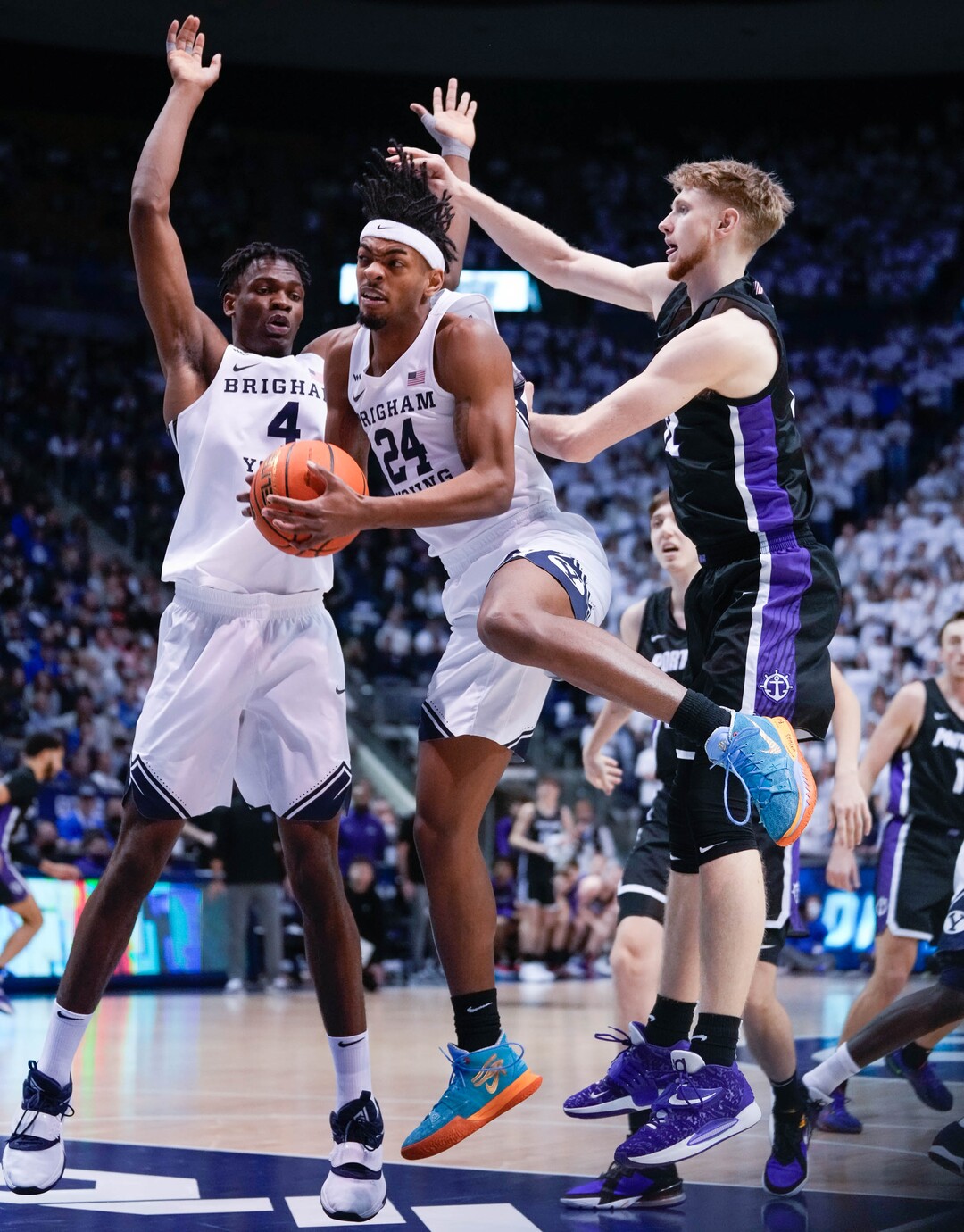 (Francisco Kjolseth | The Salt Lake Tribune) Brigham Young Cougars forward Seneca Knight (24) wins the rebound in WCC basketball action between the Brigham Young Cougars and the Portland Pilots, at the Marriott Center, on Saturday, January 22, 2022.