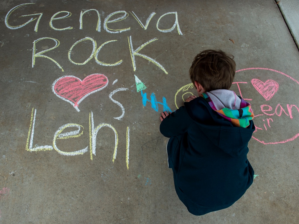 (Rick Egan  |  The Salt Lake Tribune)   Felicity Hoffert 10, draws on the side walk in front of the Lehi City Hall, to protest the expansion of Geneva Rock's mining activities near their neighborhood, Tuesday, April 2, 2019.