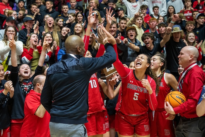 (Rick Egan | The Salt Lake Tribune) The Bountiful Redhawks celebrate their win over the Springville Red Devils, for the Girls 5A State Championship at Weber State, on Saturday, March 4, 2023.
