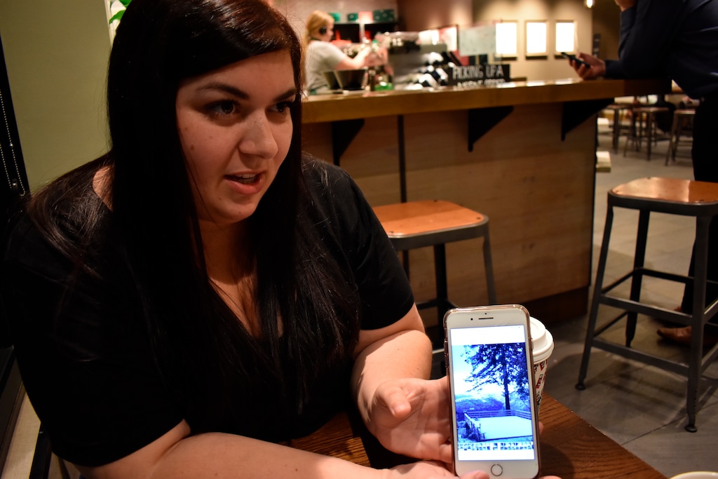 (Matthew Brown | AP) Kelsey Norton shows pictures of her property before it was overrun by a wildfire that incinerated her house and killed 85 of her fellow townspeople in Chico, Calif. Norton says she's suffered repeated respiratory infections since breathing in smoke from the fire that destroyed her hometown of Paradise in 2018.