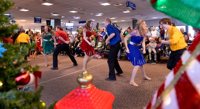 (Leah Hogsten | The Salt Lake Tribune) Clayton Production team dancers entertain the Gold Star families on Saturday. Ten Gold Star families from Salt Lake City were treated to a Winter Wonderland scene, including Whoville and the Grinch at their boarding gate at Salt Lake International Airport, Dec. 7, 2019 before their flight to Disney World aboard the Snowball Express. This month, the Gary Sinise Foundation's Snowball Express will fly more than 1,700 family members of fallen U.S. military heroes to Disney World for a holiday retreat.