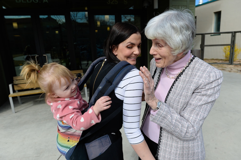 (Francisco Kjolseth | The Salt Lake Tribune) Eva May Densley, 1, carried by her mother Michelle, calls out "grandma" after catching a glimpse of champion for the homeless Pamela Atkinson while touring the YWCA Center for Women & Familes in Salt Lake on Tuesday, March 20, 2018. Atkinson, an advocate for Utahns in need, died Oct. 10, 2026, at age 94.