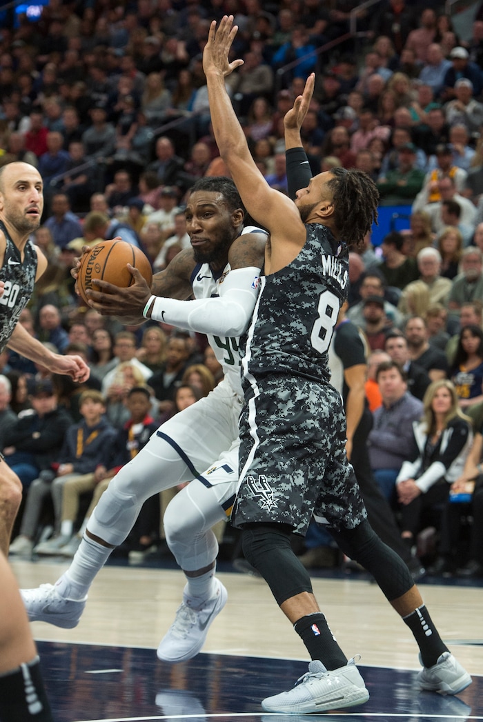 (Rick Egan  |  The Salt Lake Tribune)   Utah Jazz forward Jae Crowder (99) moves inside with the ball, as San Antonio Spurs guard Patty Mills (8) defends, in NBA action, in Salt Lake City, Monday, February 12, 2018.