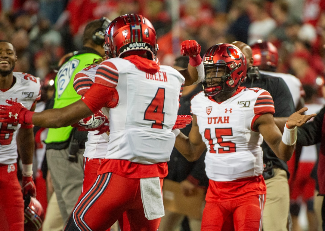 (Rick Egan  |  The Salt Lake Tribune)      Utah Utes quarterback Jason Shelley (15), Utah Utes running back TJ Green (4) after he scored a touchdown, in PAC-12 action between the Utah Utes and the Arizona Wildcats in Tucson, Saturday, Nov. 23, 2019.
