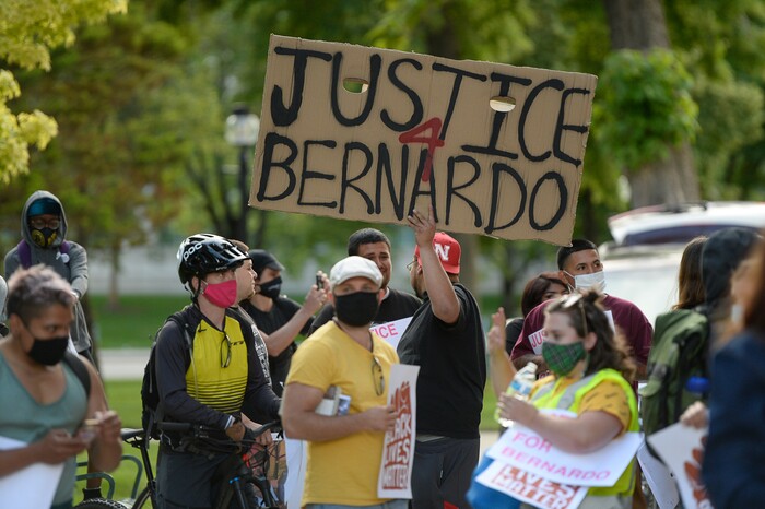 (Francisco Kjolseth  |  The Salt Lake Tribune) Demonstrators plaster City Hall with signs in Salt Lake City for a Justice for Bernardo Palacios Rally, on Thursday, June 18, 2020.